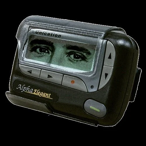 A vintage electronic device with a display showing a pair of eyes and the text 'Alpha Elegant'.
