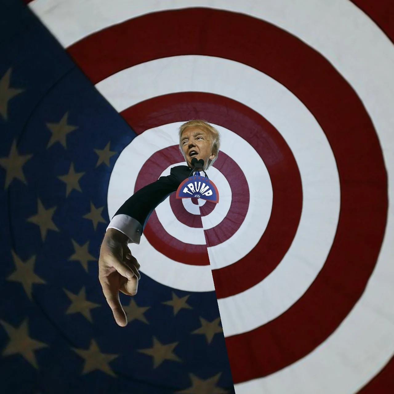 A person with the face of Donald Trump is standing in front of a large American flag background with a bullseye target pattern. The person's hand is pointing downward, and they wear a black suit with a 'TRUMP' badge around their neck.