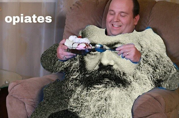 A man sitting on a couch holding a small cake with ice cream, with a large black-and-white photo of a man with a mustache and a hat overlaid on his lap, creating a composite image.