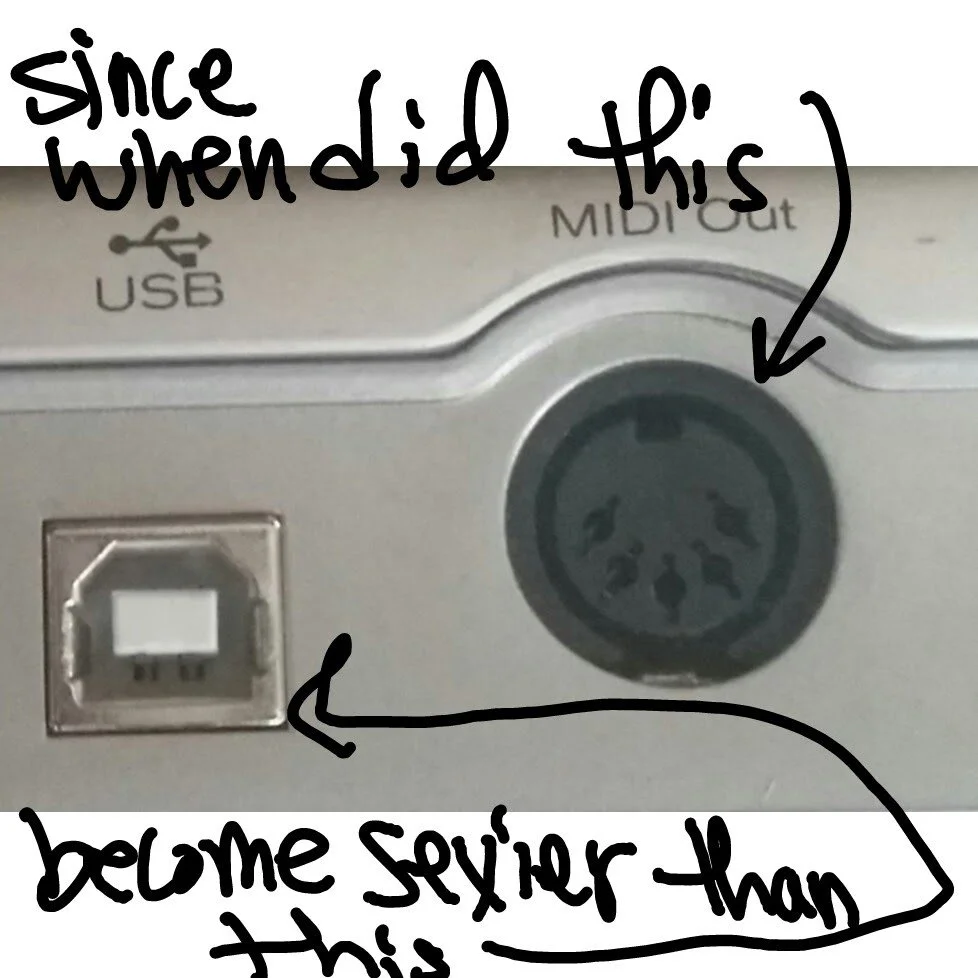 A close-up of an electronic device with handwritten notes on it. The notes say, 'since when did this become security than this,' pointing to a circular port labeled 'MIDI out' and an Ethernet port.