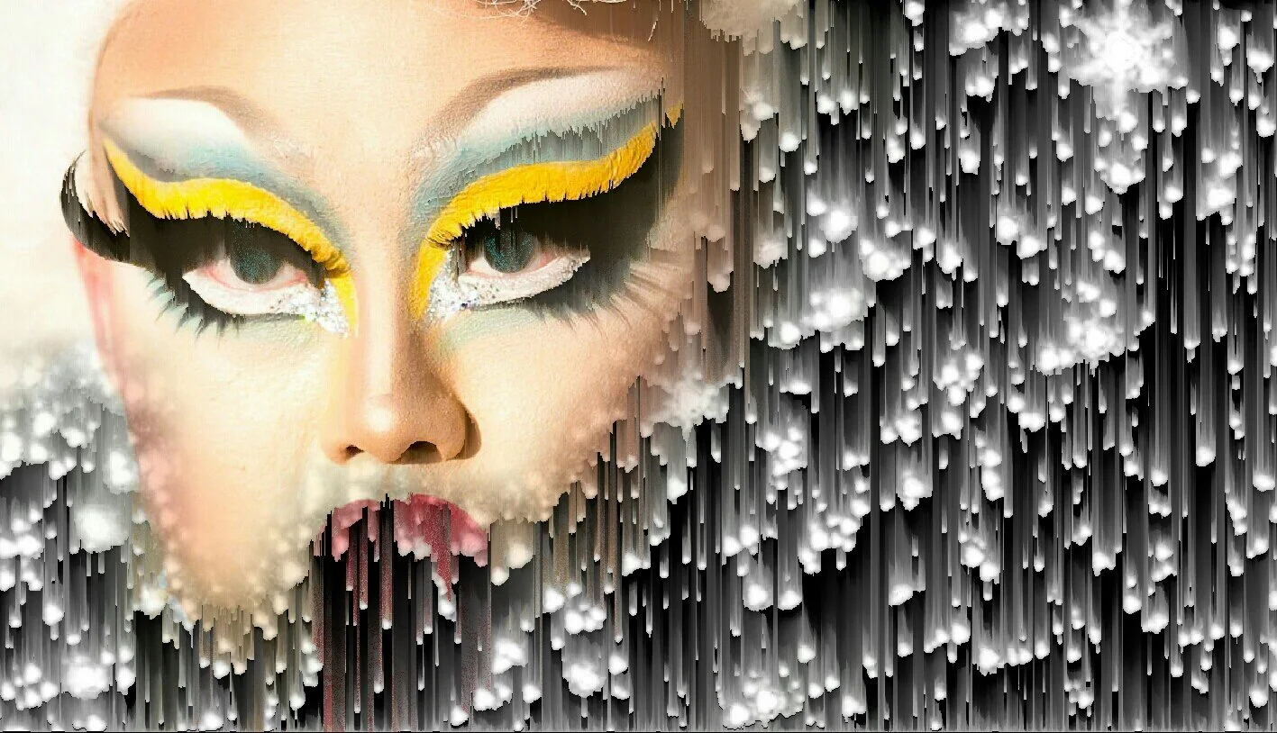 Close-up of a singer with dramatic makeup, including yellow eyeliner and eye shadow, pink lips, and elaborate eye makeup, with an abstract, textured black and white background.
