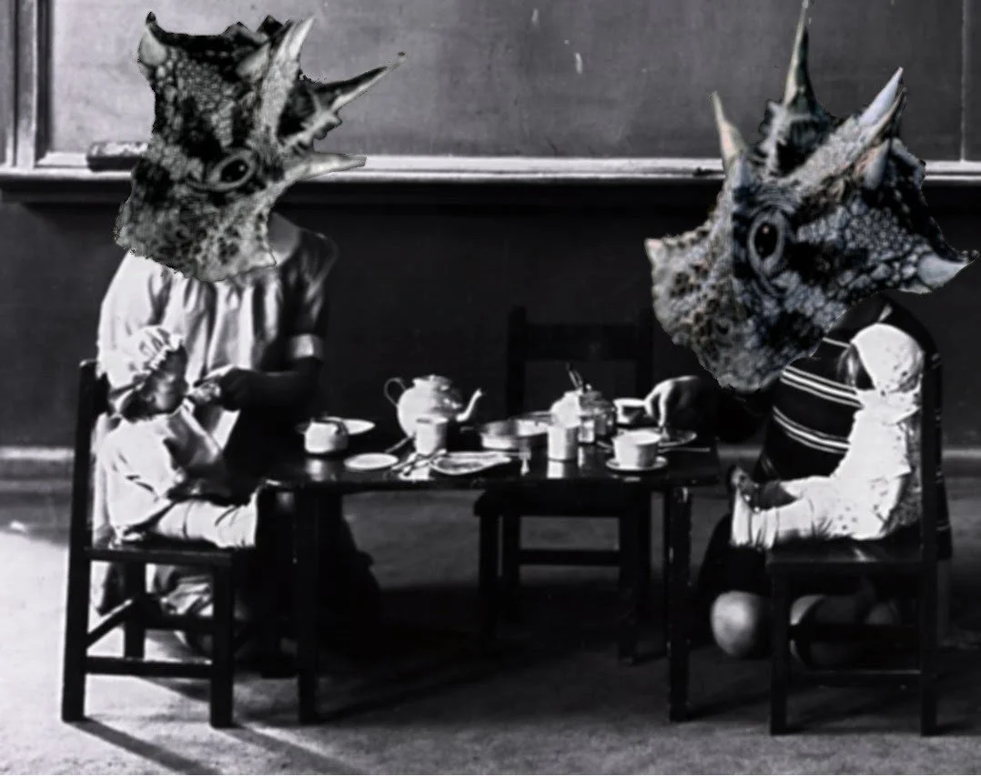 Black and white photo of two children sitting at a tea table with animal faces superimposed on their heads, resembling fish or aquatic creatures, in an indoor setting.