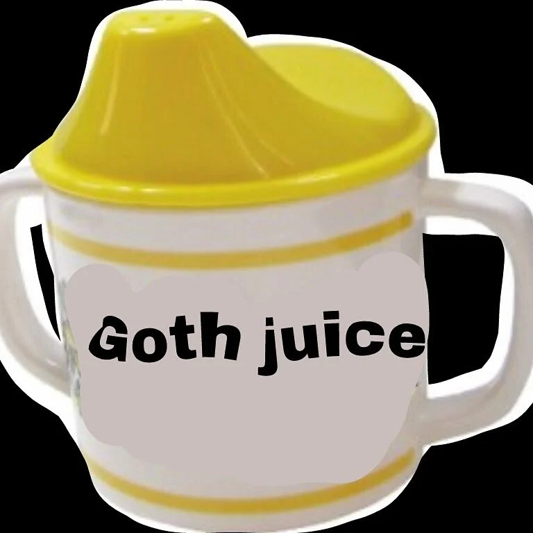 A ceramic mug with a yellow lemon squeezer lid and the words 'Goth juice' printed on it.