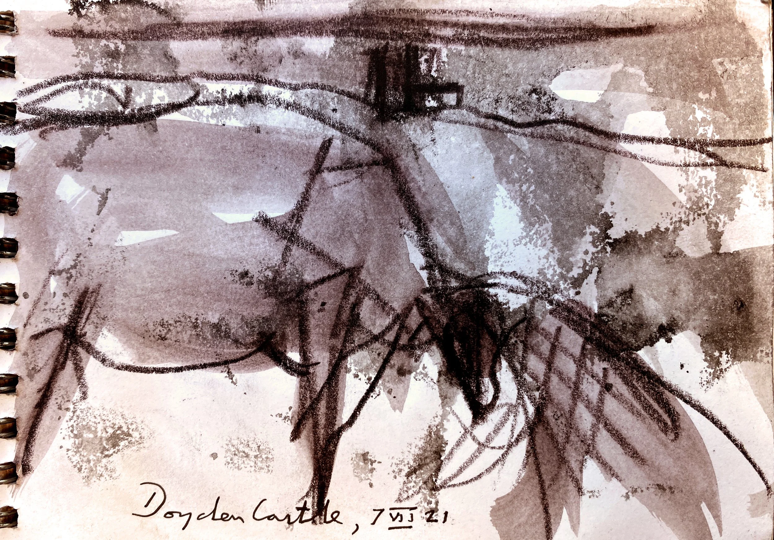 A black crayon drawing of a giraffe on a piece of paper with some scribbles and a few patches of white background. The paper is spiral-bound on the left, and there is handwritten text beneath the drawing that reads 'Dogden Castle, 7/5/21'.