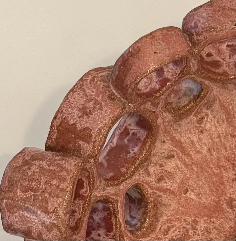 Close-up of glazed pottery inspired by blossom tree