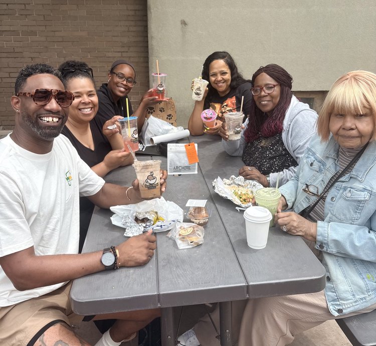 Guests enjoying Bravo Beans drinks together around a table