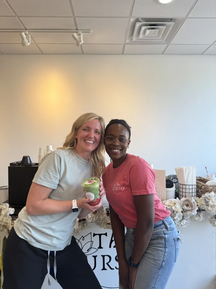 Two guests smiling with a matcha drink at a Bravo Beans pop-up