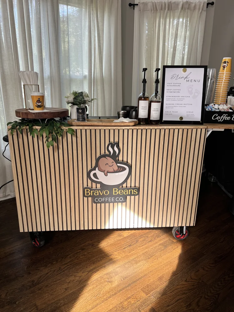 The Bravo Beans wood-slat coffee cart with its menu board