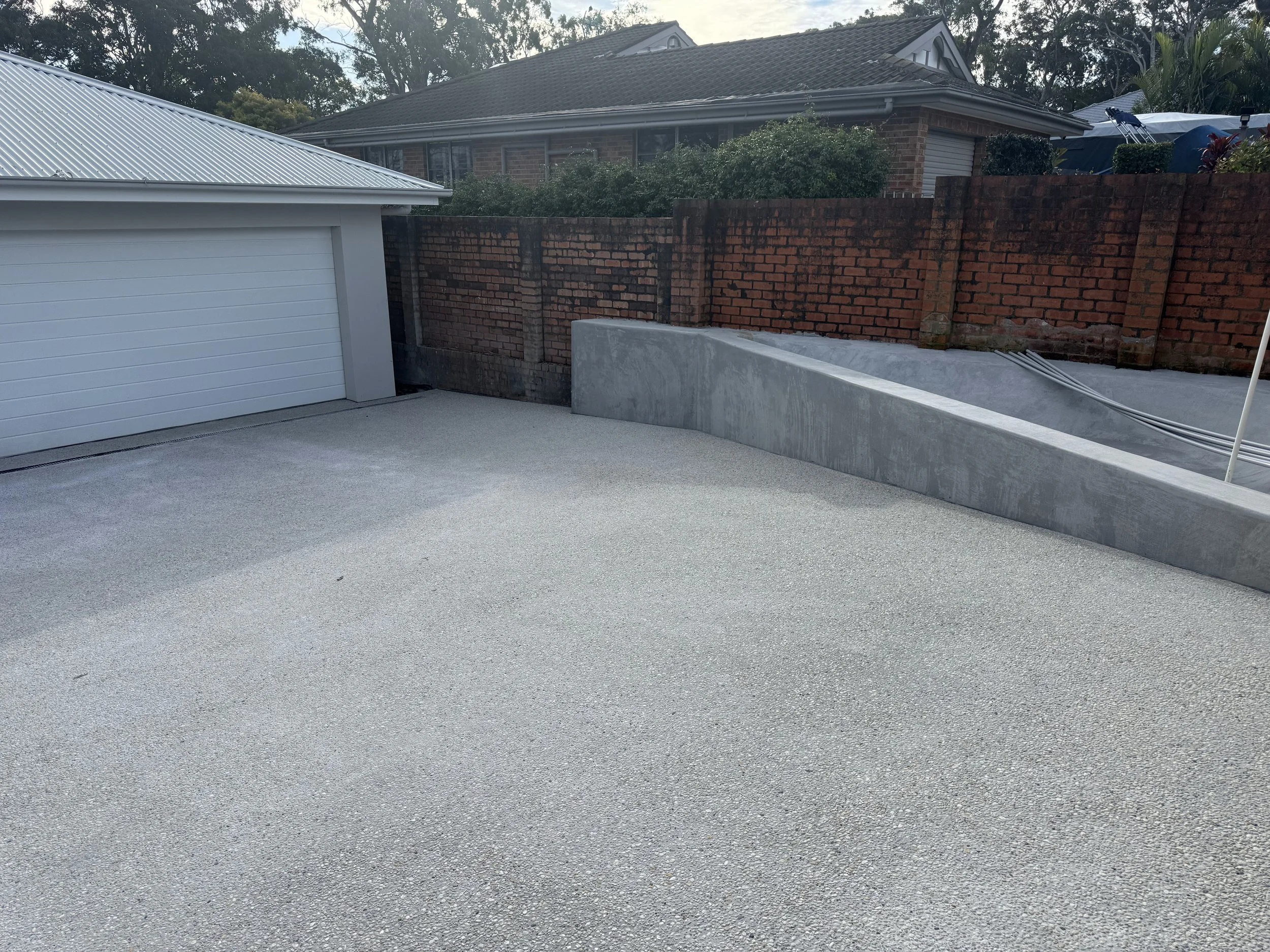 Concrete removal, base preparation and compaction ready for new concrete installation.