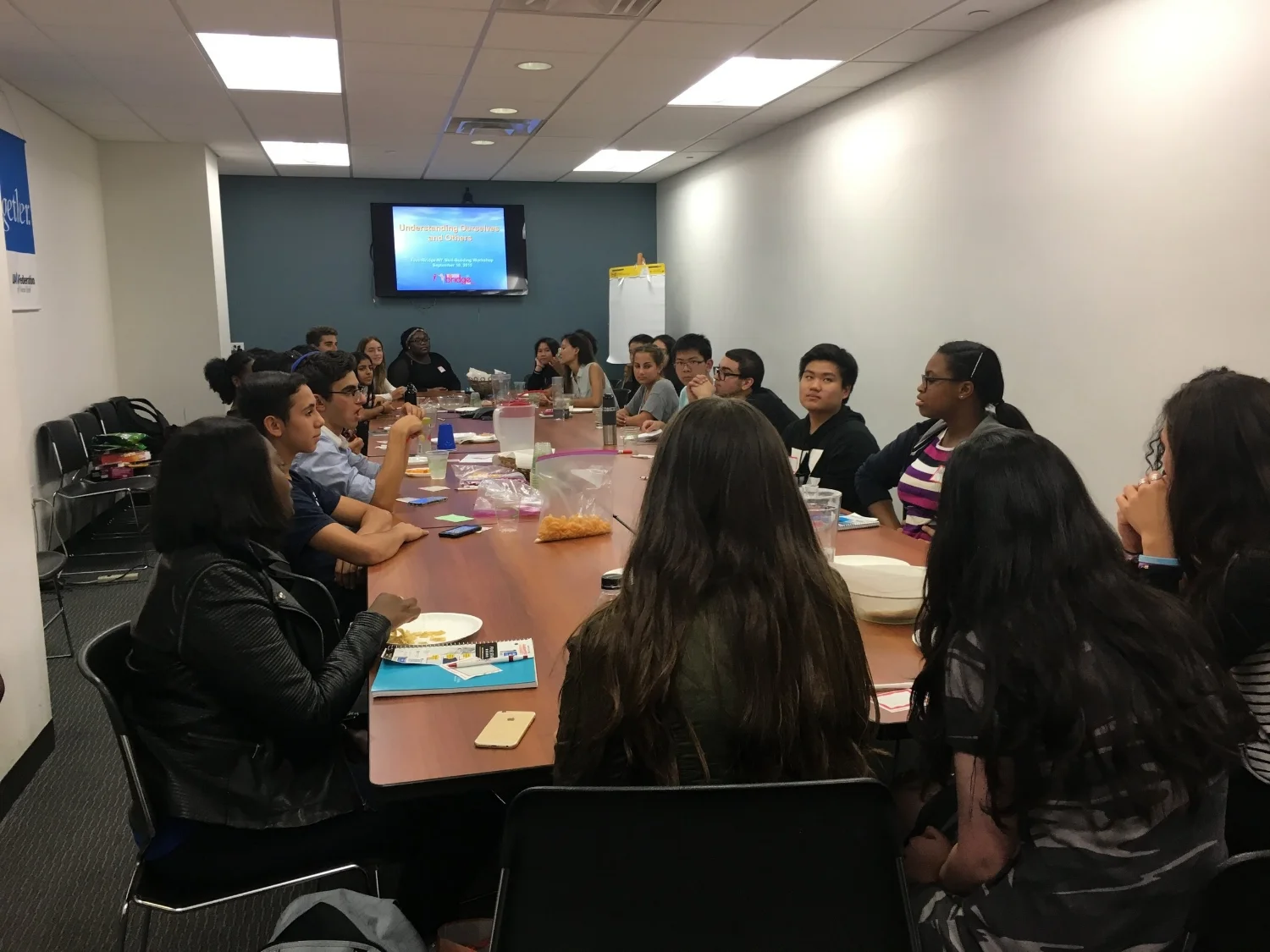 Fellows get acquainted with each other at their first meeting of the year