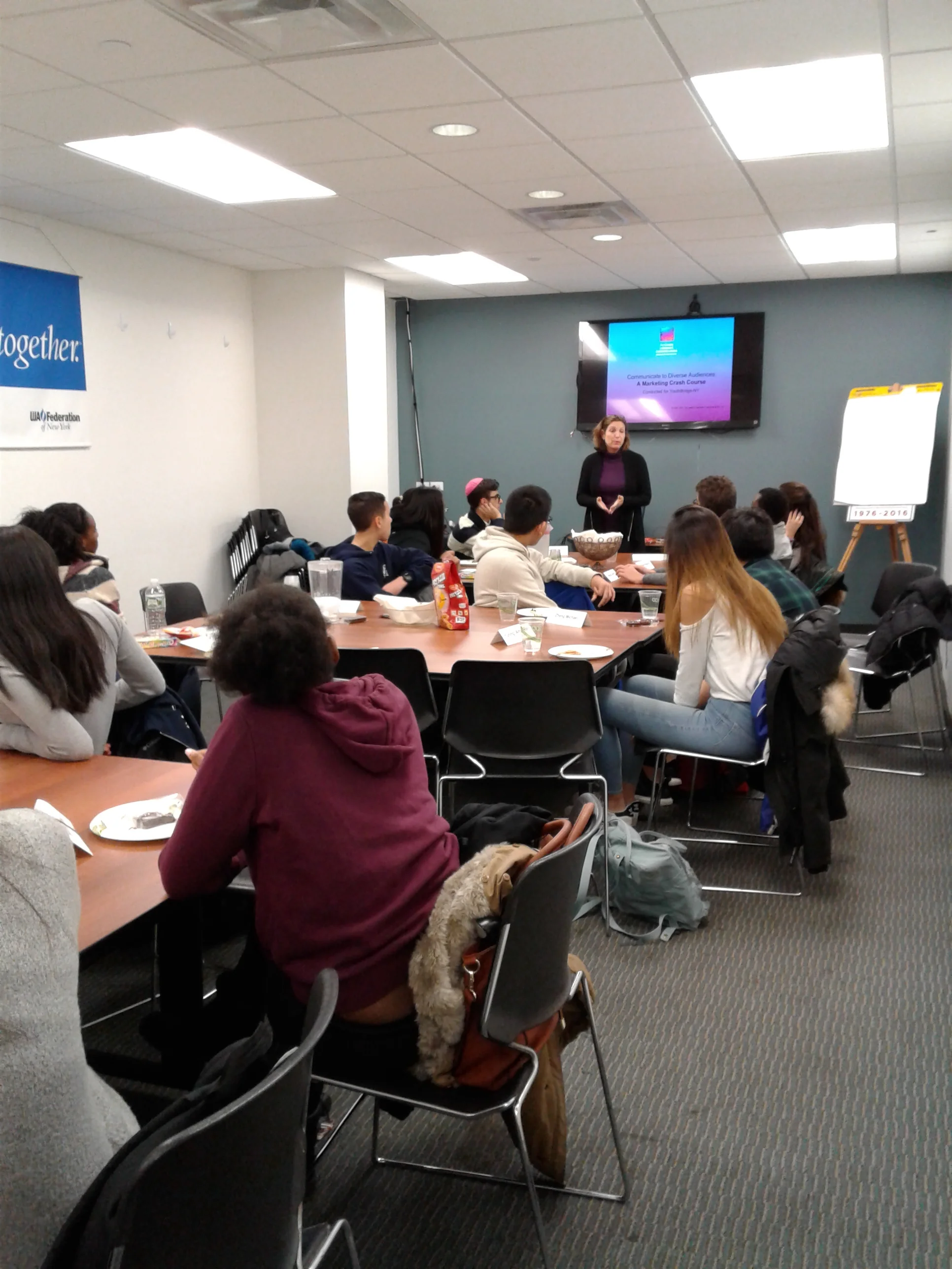 Fellows get a crash course in the world of marketing and communications with YouthBridge-NY Board Member Ivy Cohen.&nbsp;