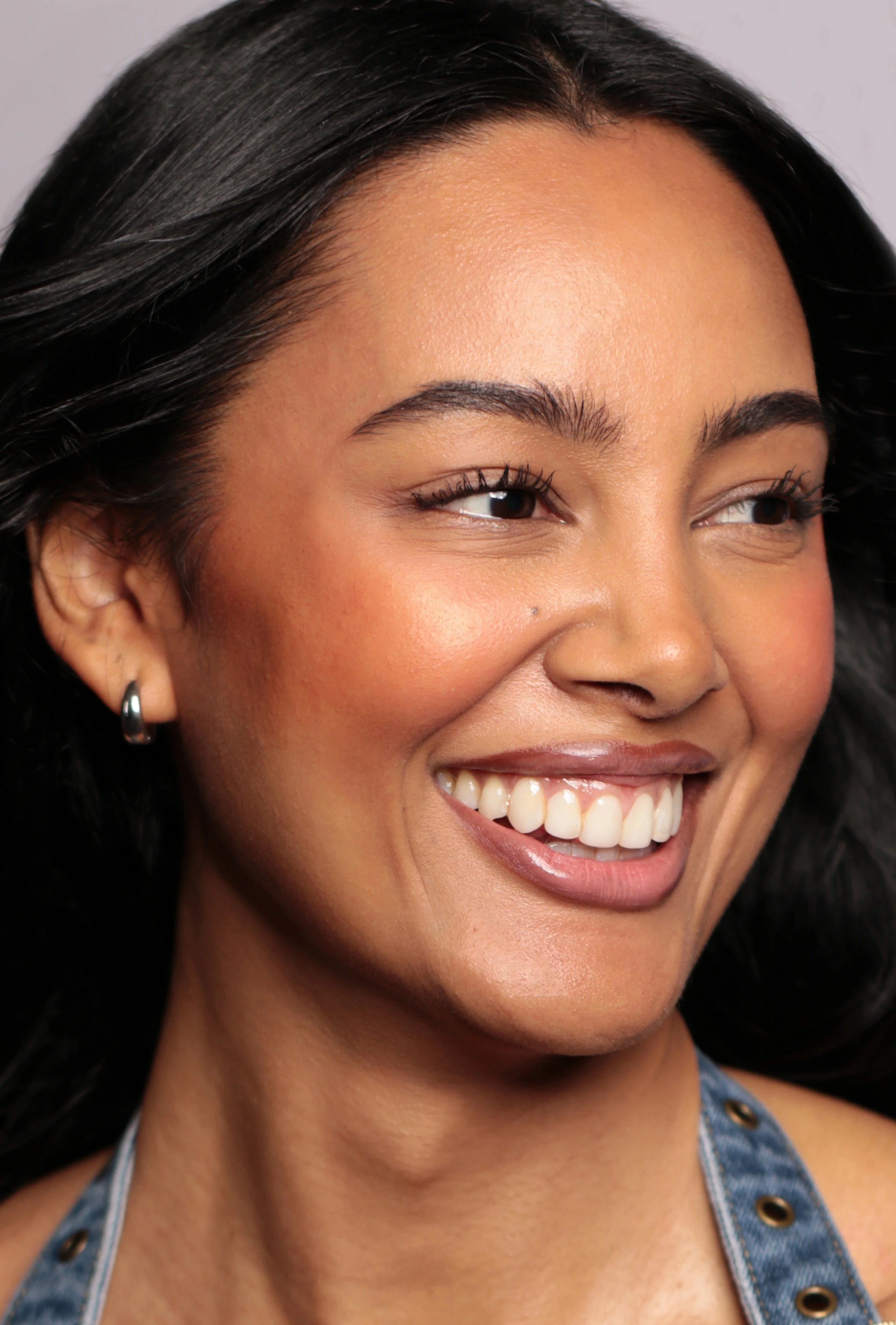 Commercial lifestyle and beauty model Jennifer Elysee smiling in close-up portrait