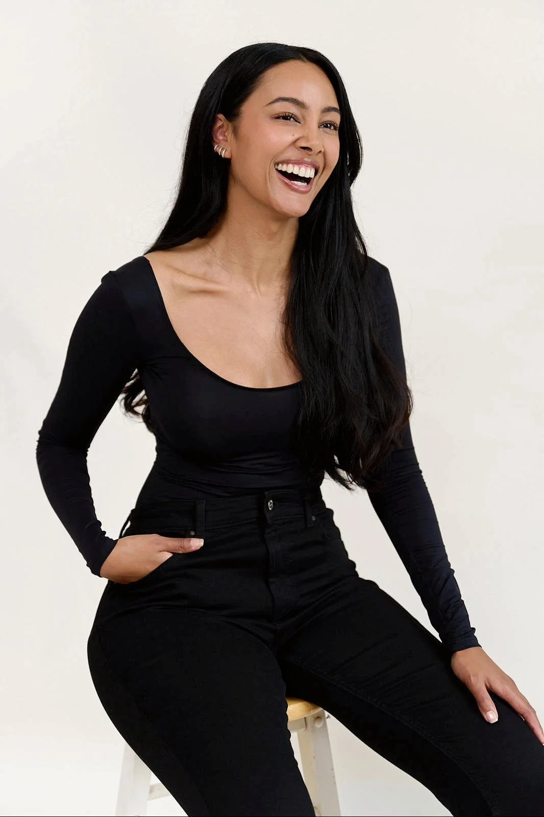 Lifestyle and commercial model Jennifer Elysee in a clean studio portrait with natural expression and minimal styling.