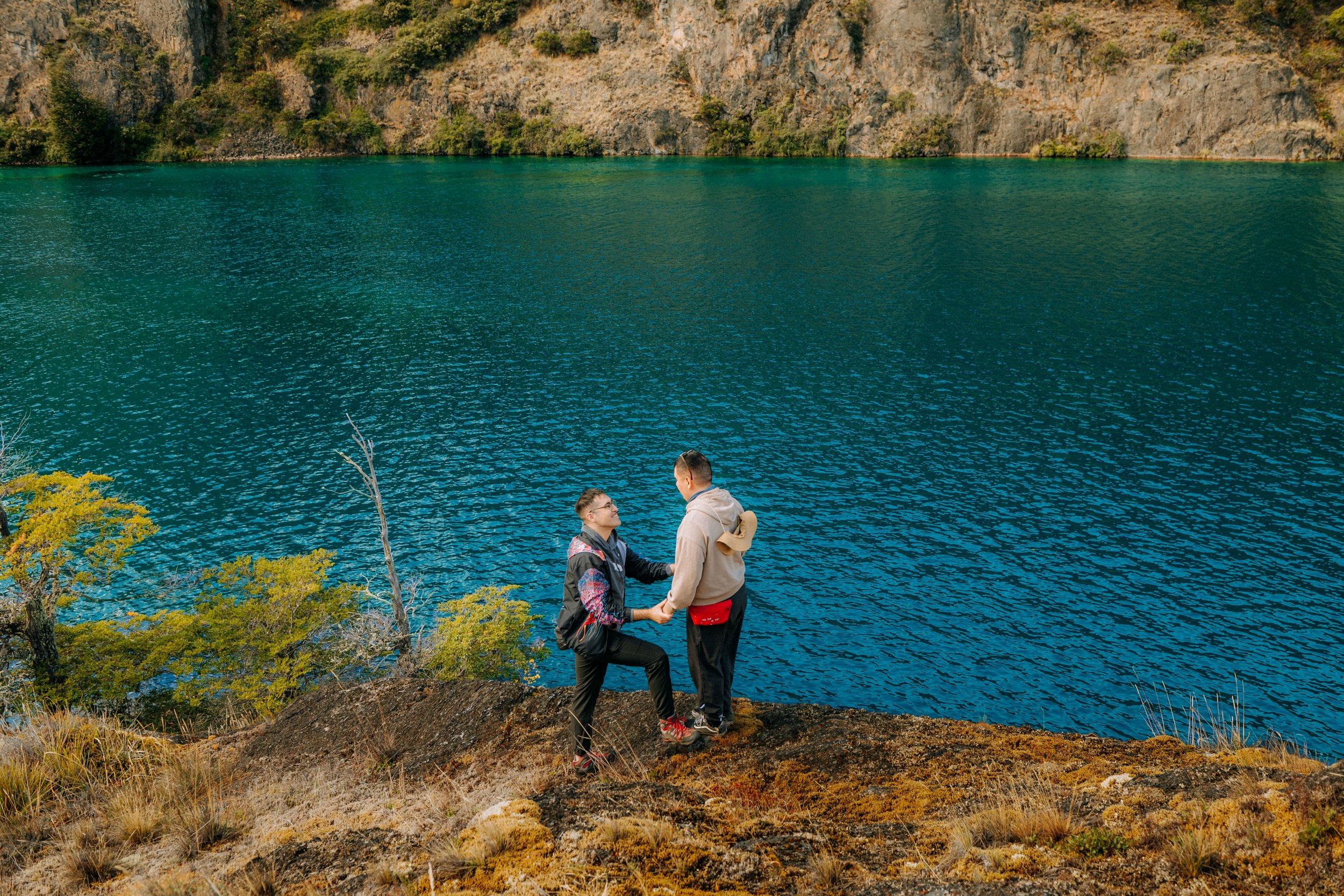 Same sex couple proposing at the Cochrane River in the Tamango area of Patagonia National Park