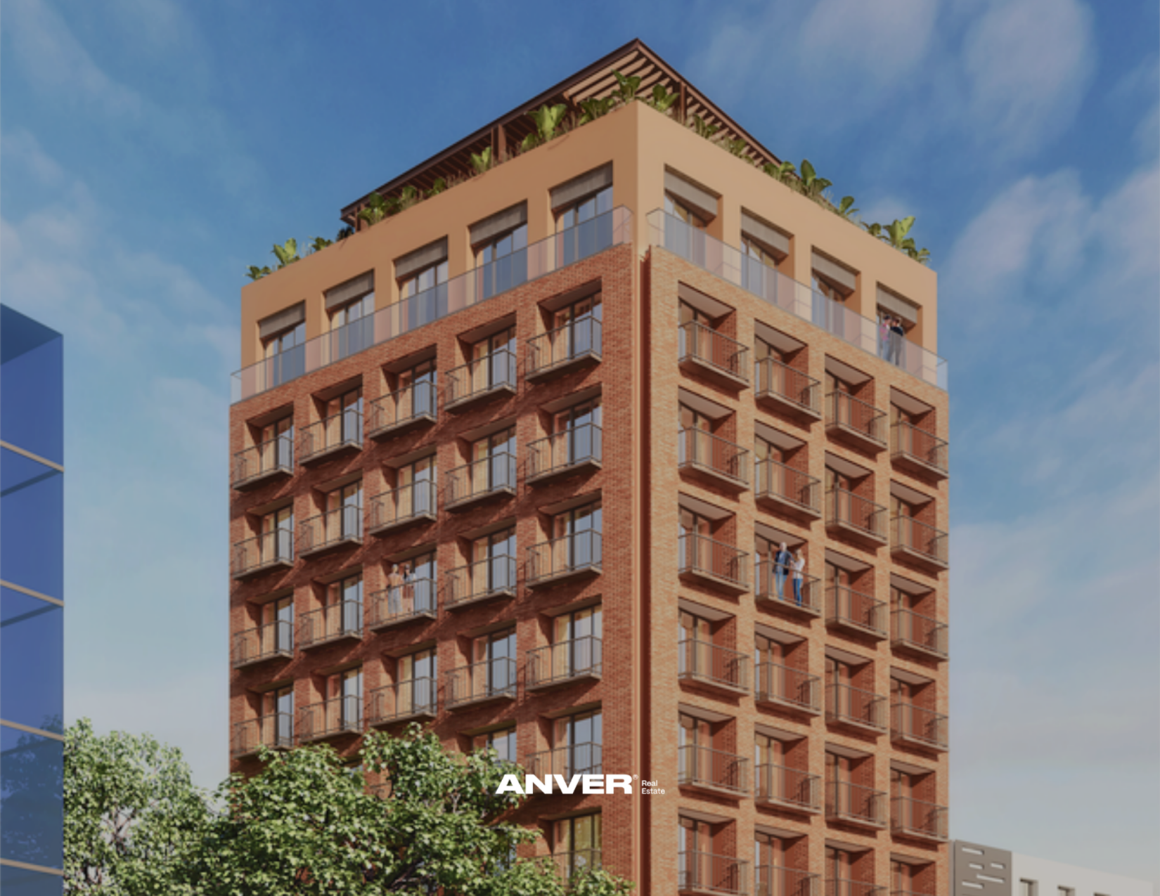Edificio modernista de varios pisos de color ladrillo con balcones y plantas en la azotea, bajo un cielo despejado.