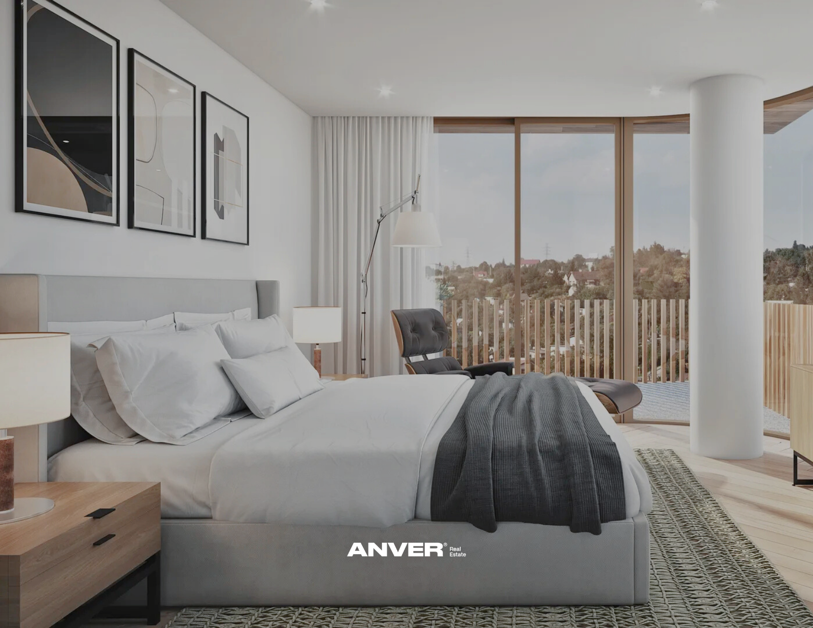 Habitación moderna con cama, sillón y vista panorámica hacia las colinas y casas desde el balcón de gran tamaño, decorada con arte abstracto y luz natural.