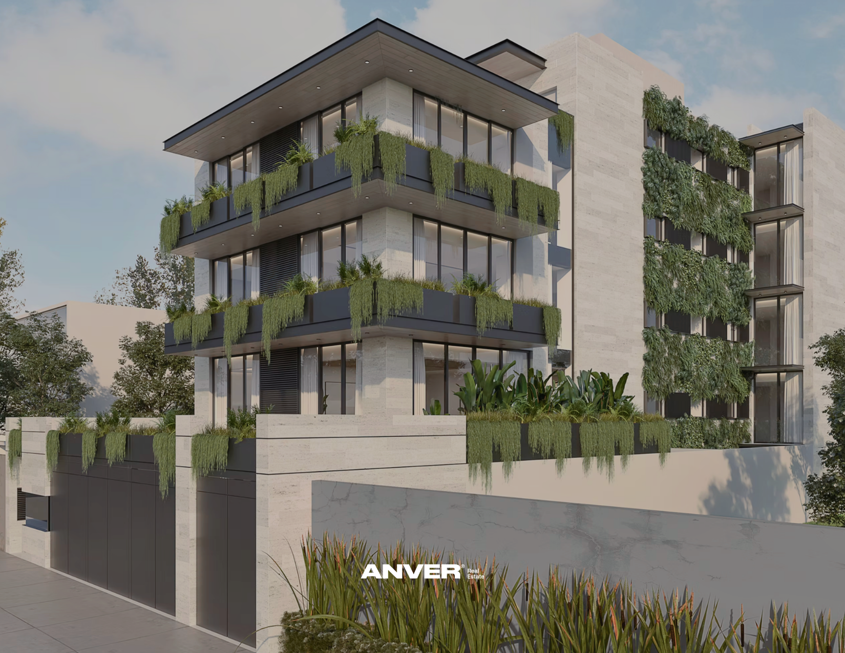 Edificio moderno de varios pisos con balcones y vegetación en las fachadas, en un entorno urbano con cielo despejado.