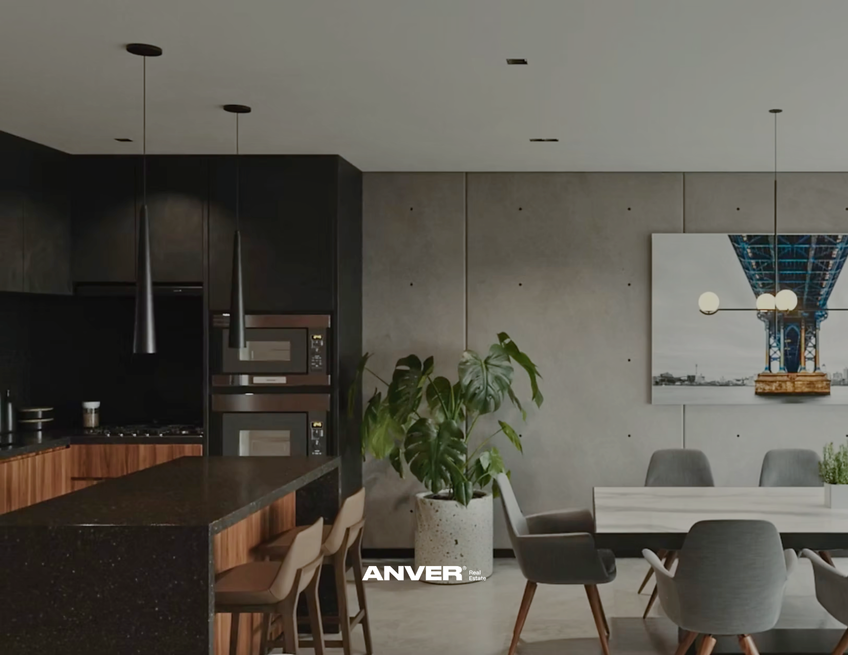 Interiores de una cocina y comedor modernos con plantas y arte en la pared.