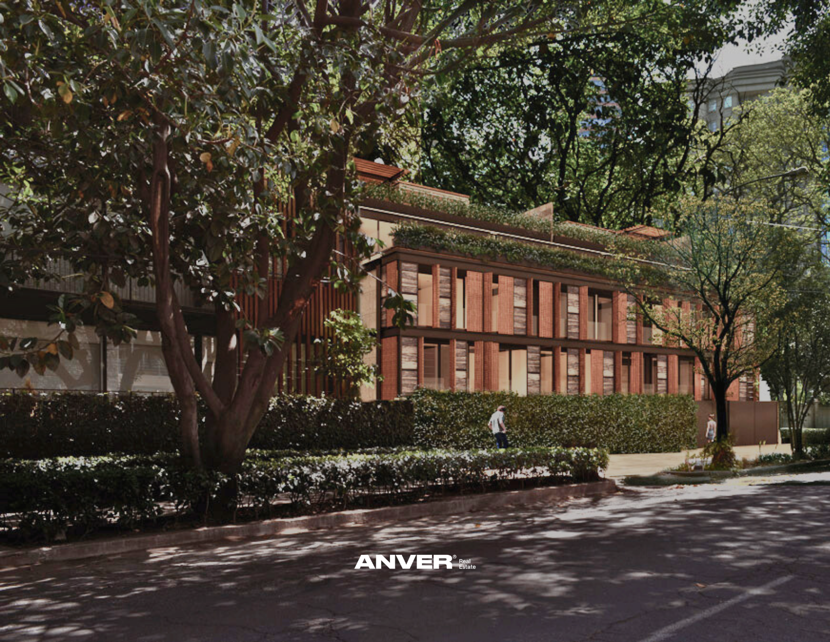 Edificio de diseño moderno con fachada de ladrillo y grandes ventanas, rodeado de árboles y arbustos, en un día soleado en la ciudad. Personas caminando por la acera.
