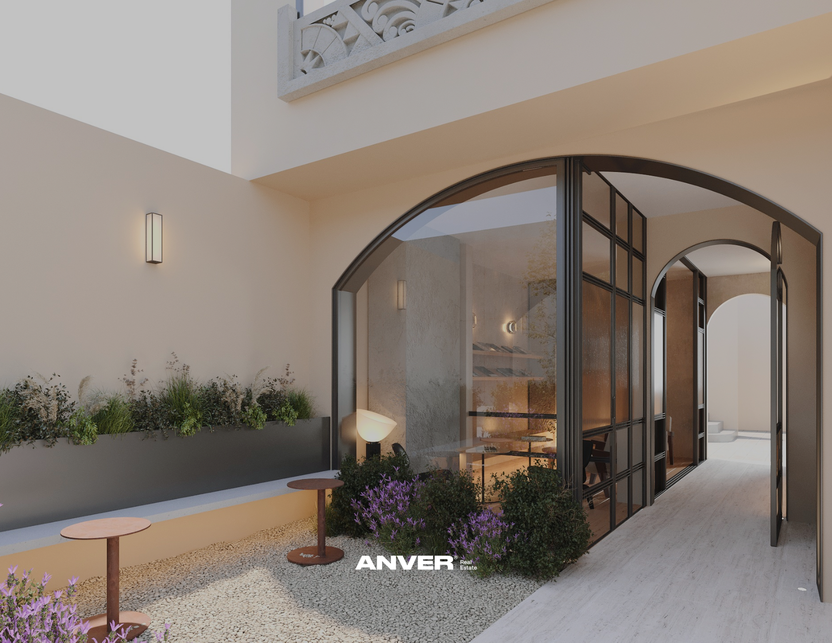 Fachada moderna de casa con paredes blancas, ventanas de vidrio y puertas de Metal negro. Jardín con plantas, paredes con luces, y una pequeña mesa de madera con una lámpara junto a la entrada.