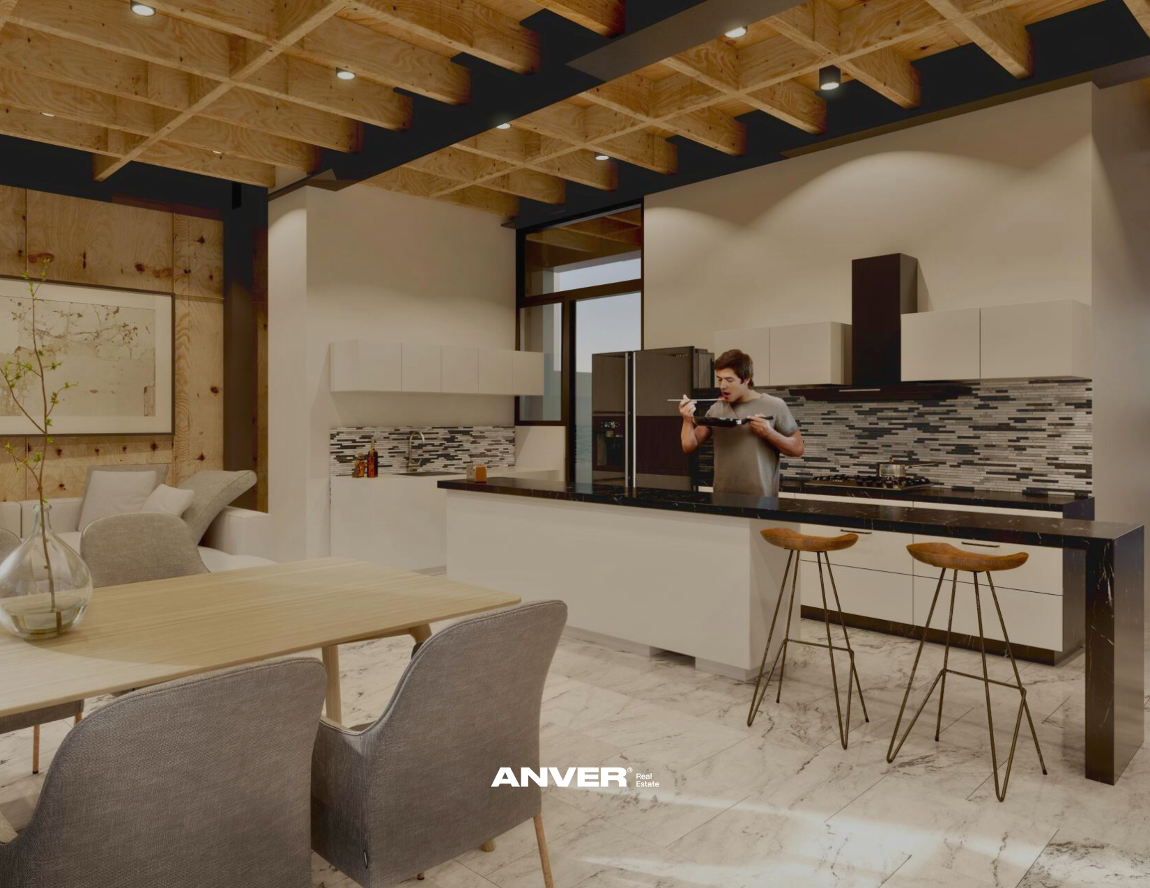 Interiores de una cocina moderna y abierta con techo de madera y áreas de descanso, con un hombre comiendo en la barra de la cocina.