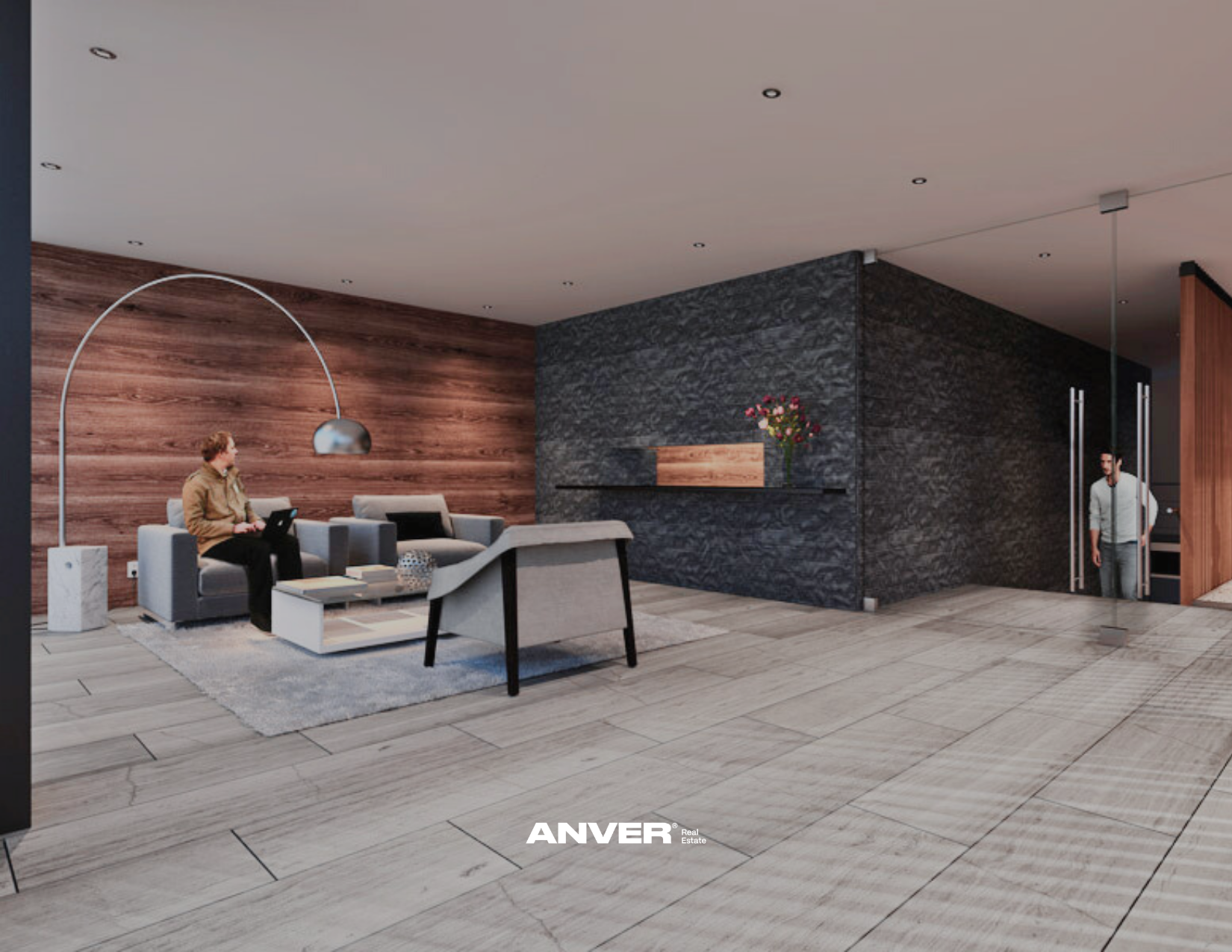 Sala moderna con paredes de madera y piedra, sillones grises, un hombre sentado con una laptop, una mujer entrando, y una mesa de centro con decoración. Incluye lámpara arcada y flores en la pared.