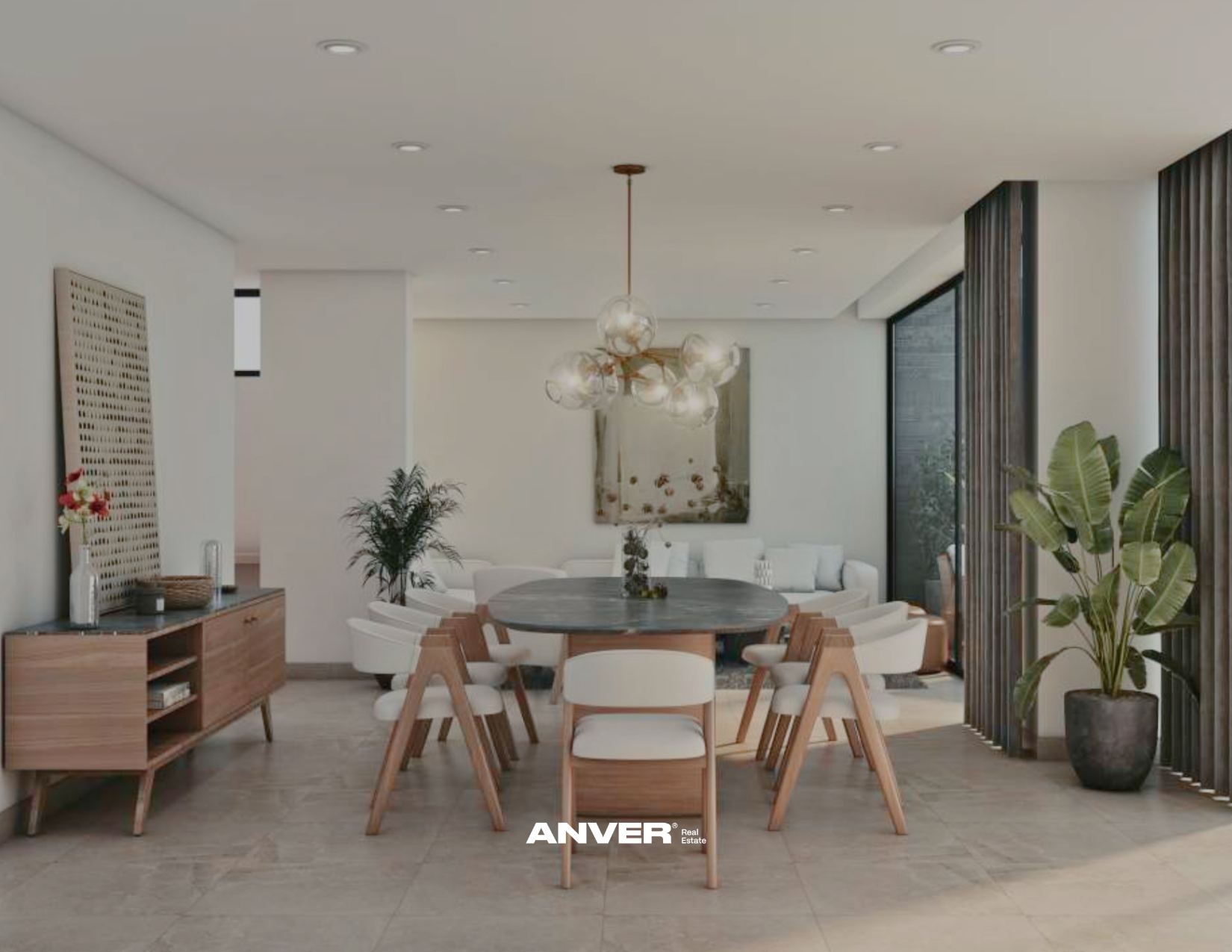 Sala de comedor moderna con mesa redonda de madera, sillas blancas y de madera, plantas verdes, lámpara de techo decorativa y detalles de diseño en muebles y paredes.