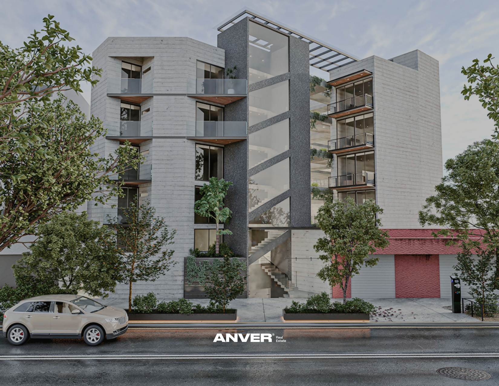 Edificio moderno de varias plantas con escaleras externas y balcones, rodeado de árboles y un coche estacionado en la calle.