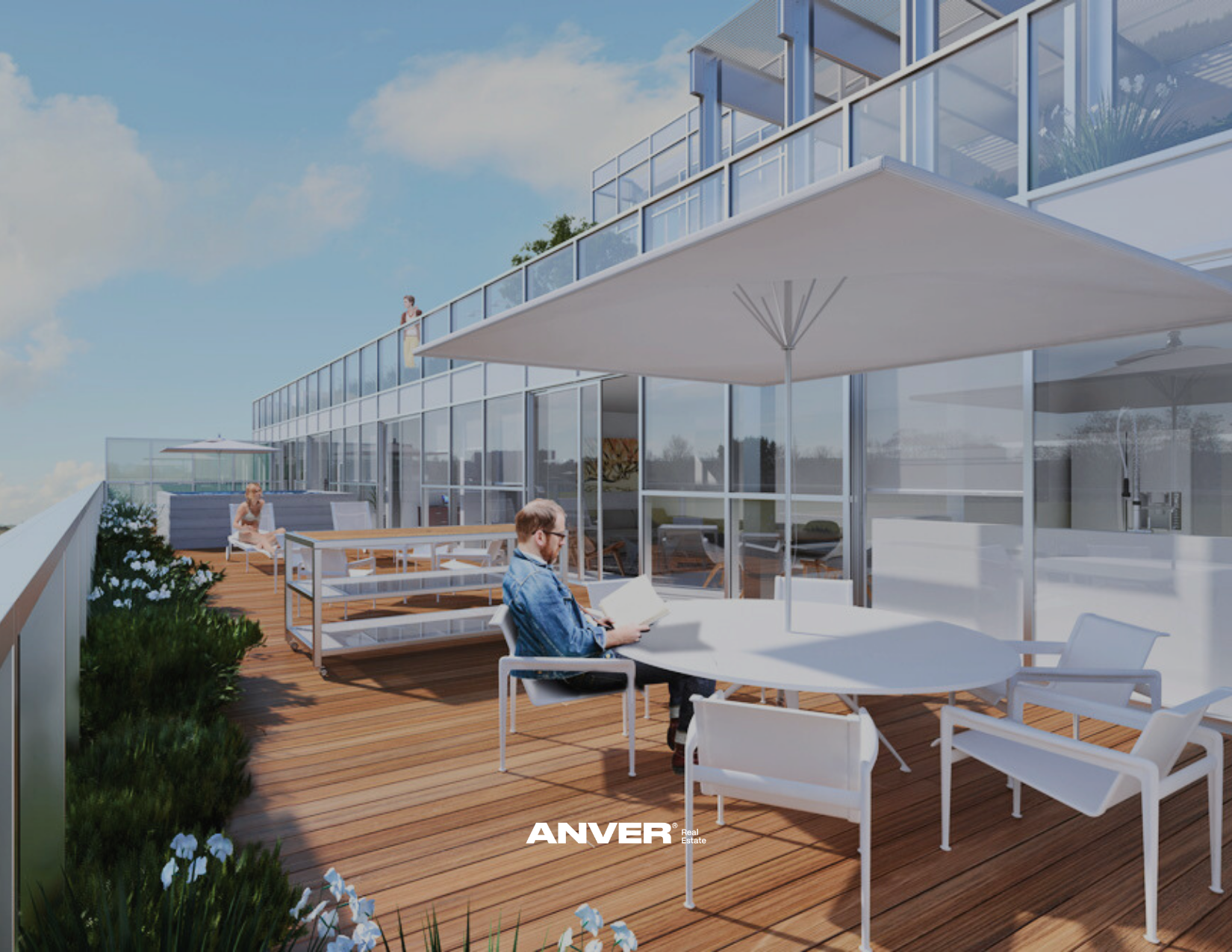 Terraza en un edificio moderno con sillones, mesas y sombrillas, personas leyendo y relajándose.