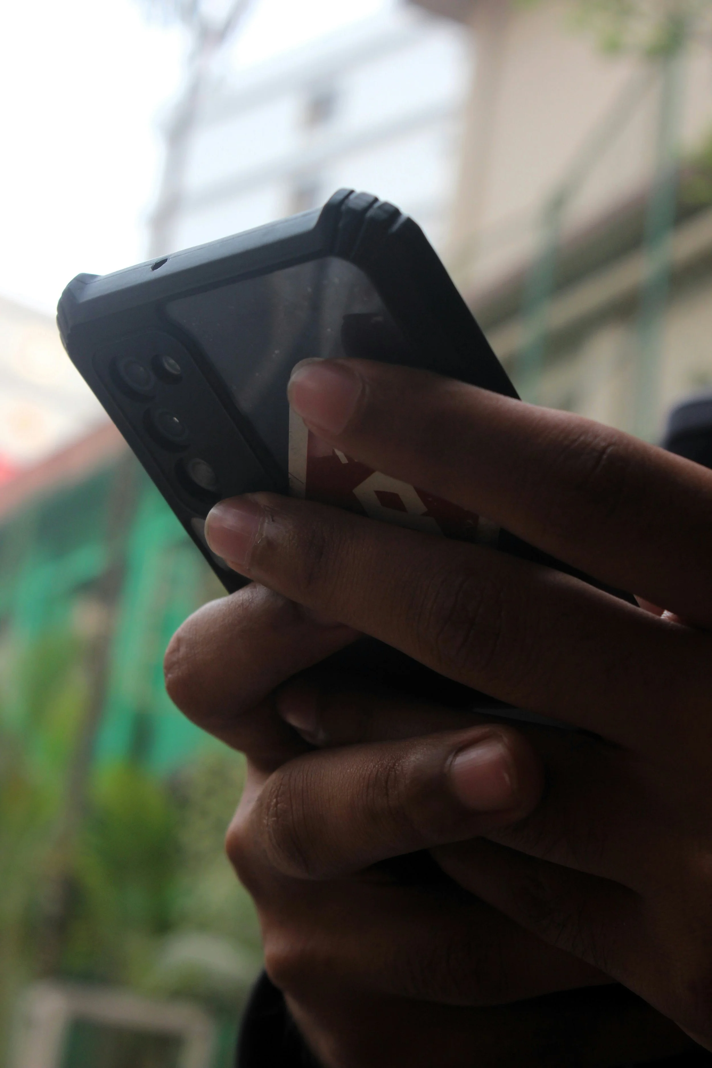 Person holding a phone while receiving guidance.
