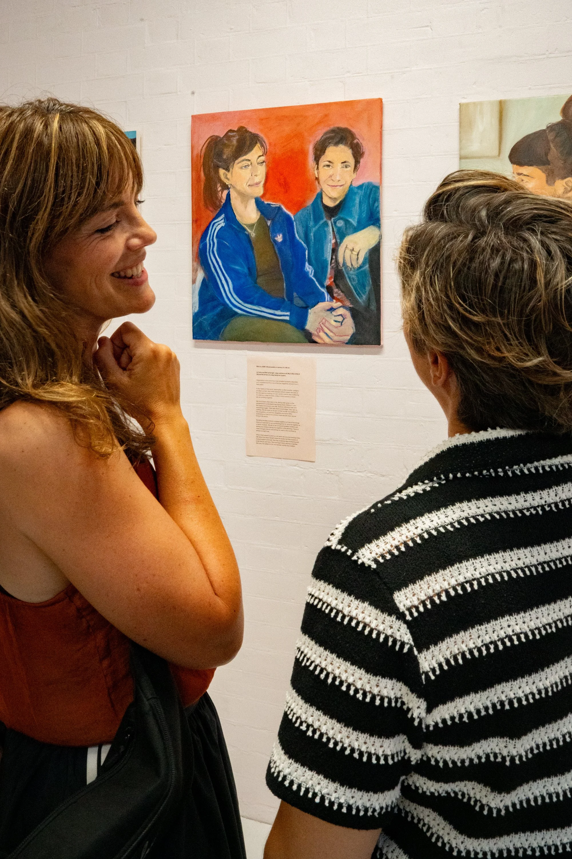 elli clasping hands with jo and portrait.jpg
