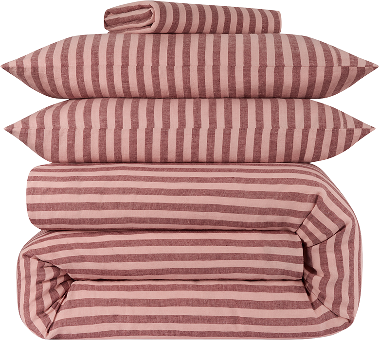 Stack of four pillows and a folded blanket, all with pink and brown striped pattern.