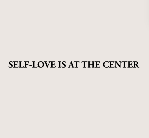 Text saying 'Self-love is at the center' on a plain, light-colored background.