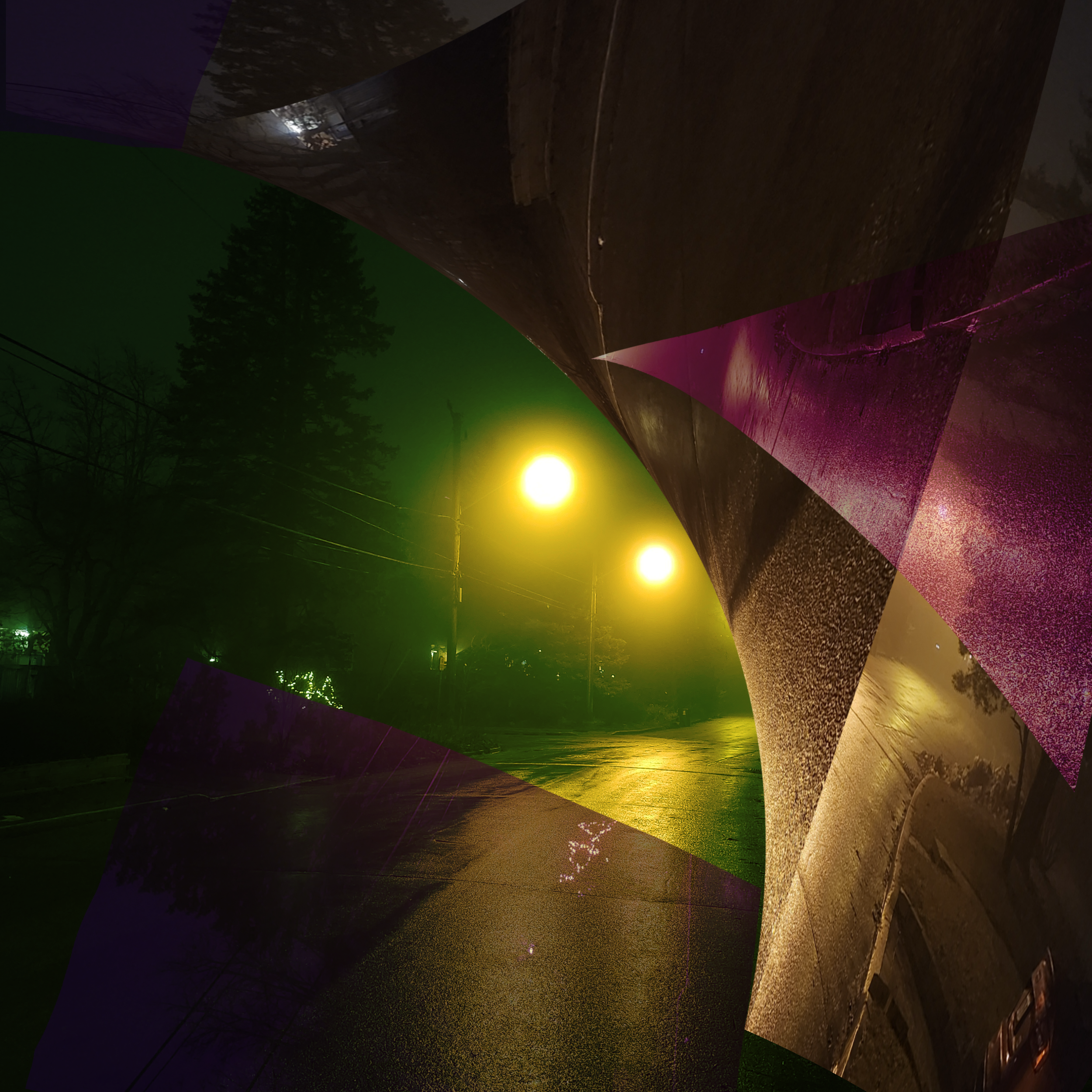 Nighttime scene with a streetlight illuminating a sidewalk and trees, with some fog or mist in the air.