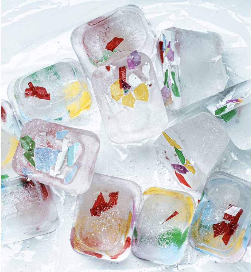 Ice cubes with colorful paper labels in a clear plastic sheet