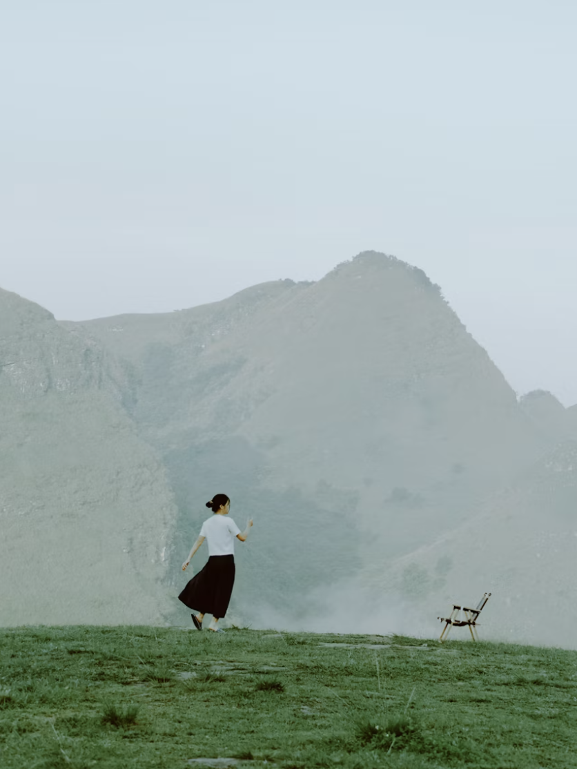 woman in a skirt on a hill