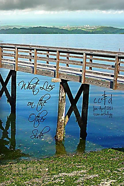 bridge or pier of wooden slats over a blue body of water
