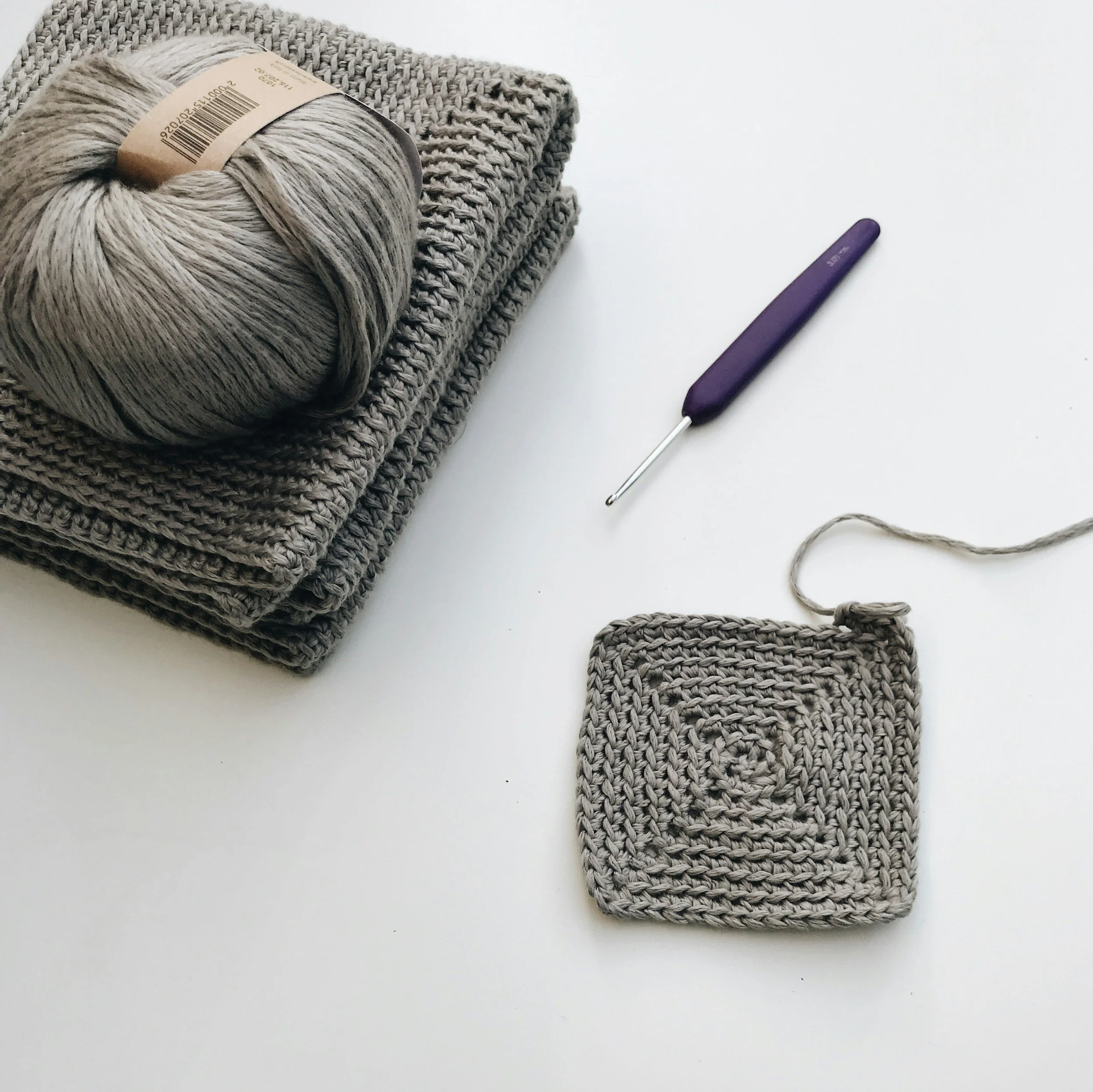 Crochet granny square and yarn