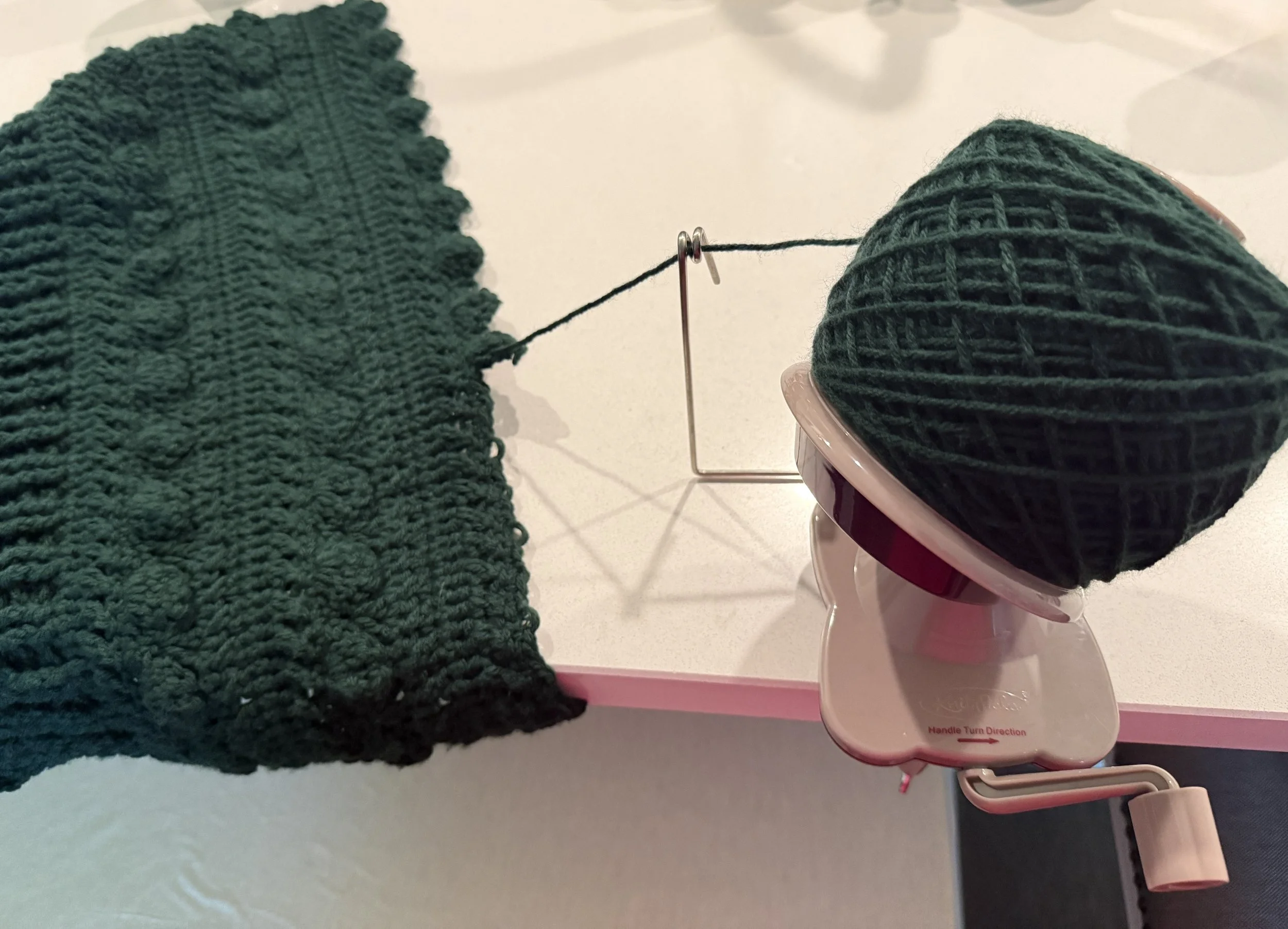 Dark green yarn on ball winder