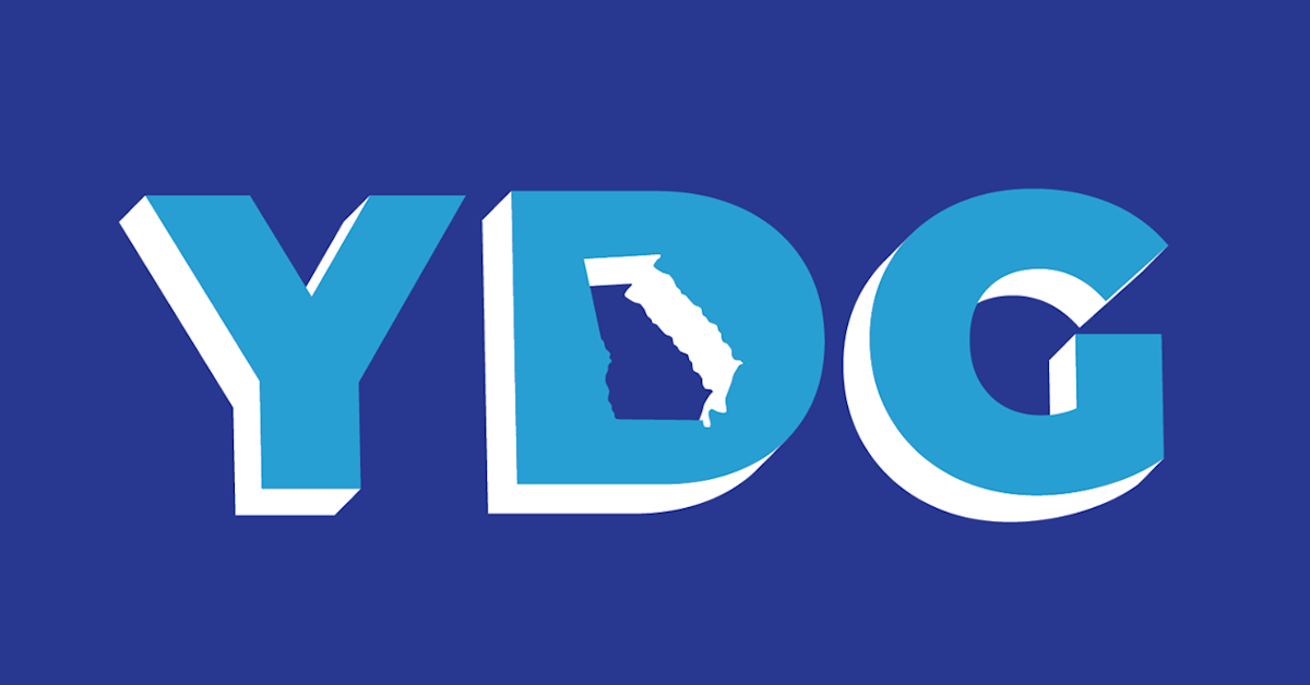 The image features the letters Y, D, and G in bold blue font with white shadows on a dark blue background. The inside of the letter D has an outline of the state of Georgia.