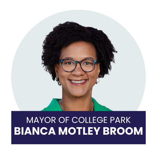 Portrait of Bianca Motley Broom, the mayor of College Park, smiling and wearing glasses and a green top.