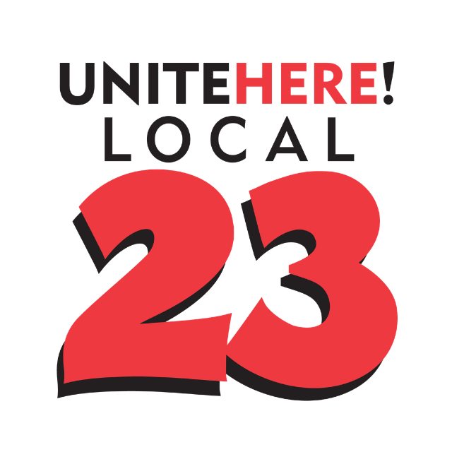 Text reading "Unite here! Local 23" with "here" in red and larger font, on a black background.