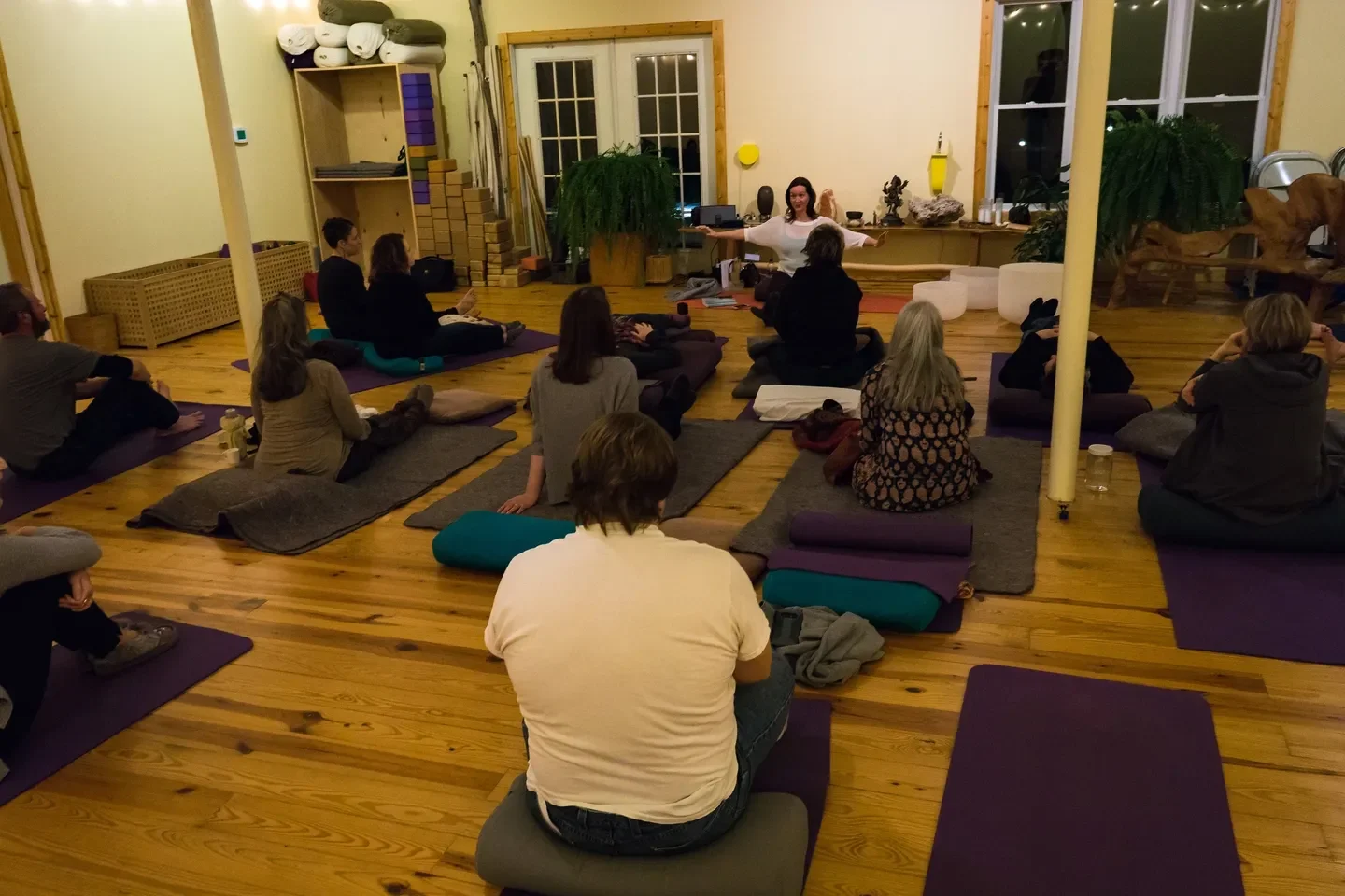 Lauren Polly speaking to a yoga community about emotional resilience, self-awareness, and human connection