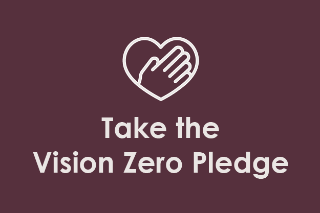 A graphic with a heart and hand symbol above the text 'Take the Vision Zero Pledge' on a purple background.