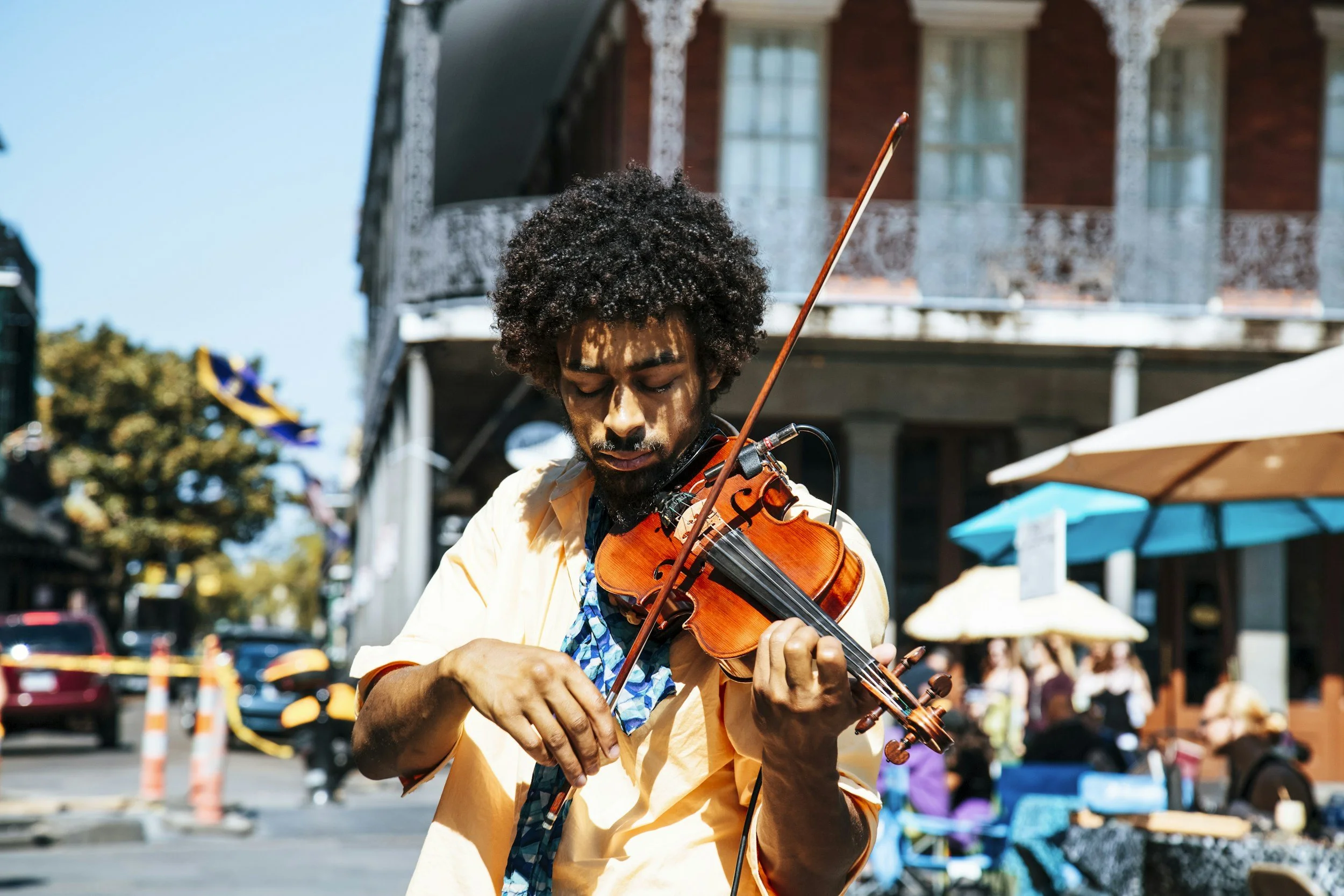Street violinist performing in New Orleans, Rooted Black heritage travel trip