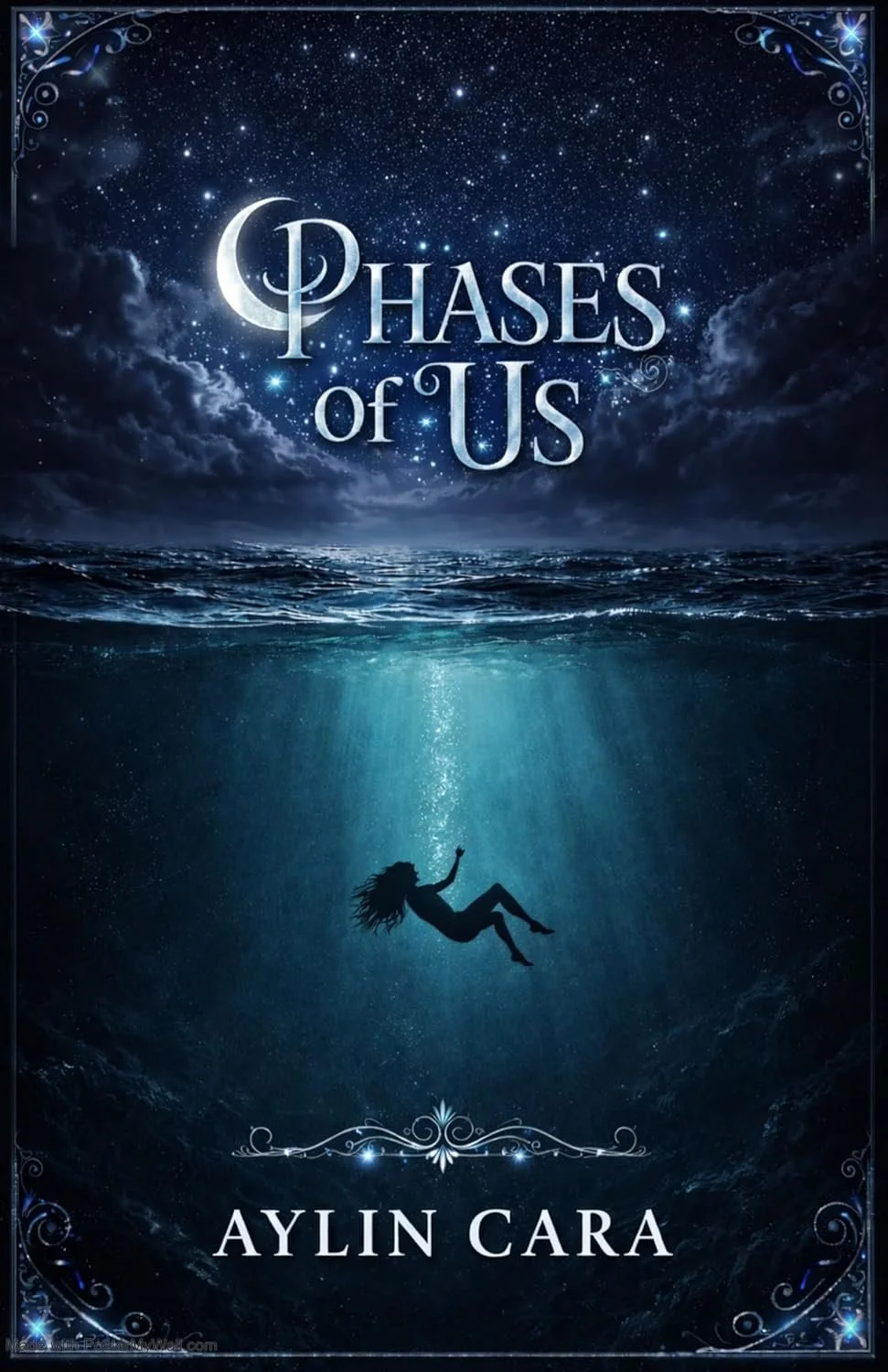 Below the water's surface, a single silhouette of a woman floats or gently sinks through a beam of underwater light illuminating the deep blue abyss. The entire image is framed by delicate, glowing blue ornate filigree borders in the corners.