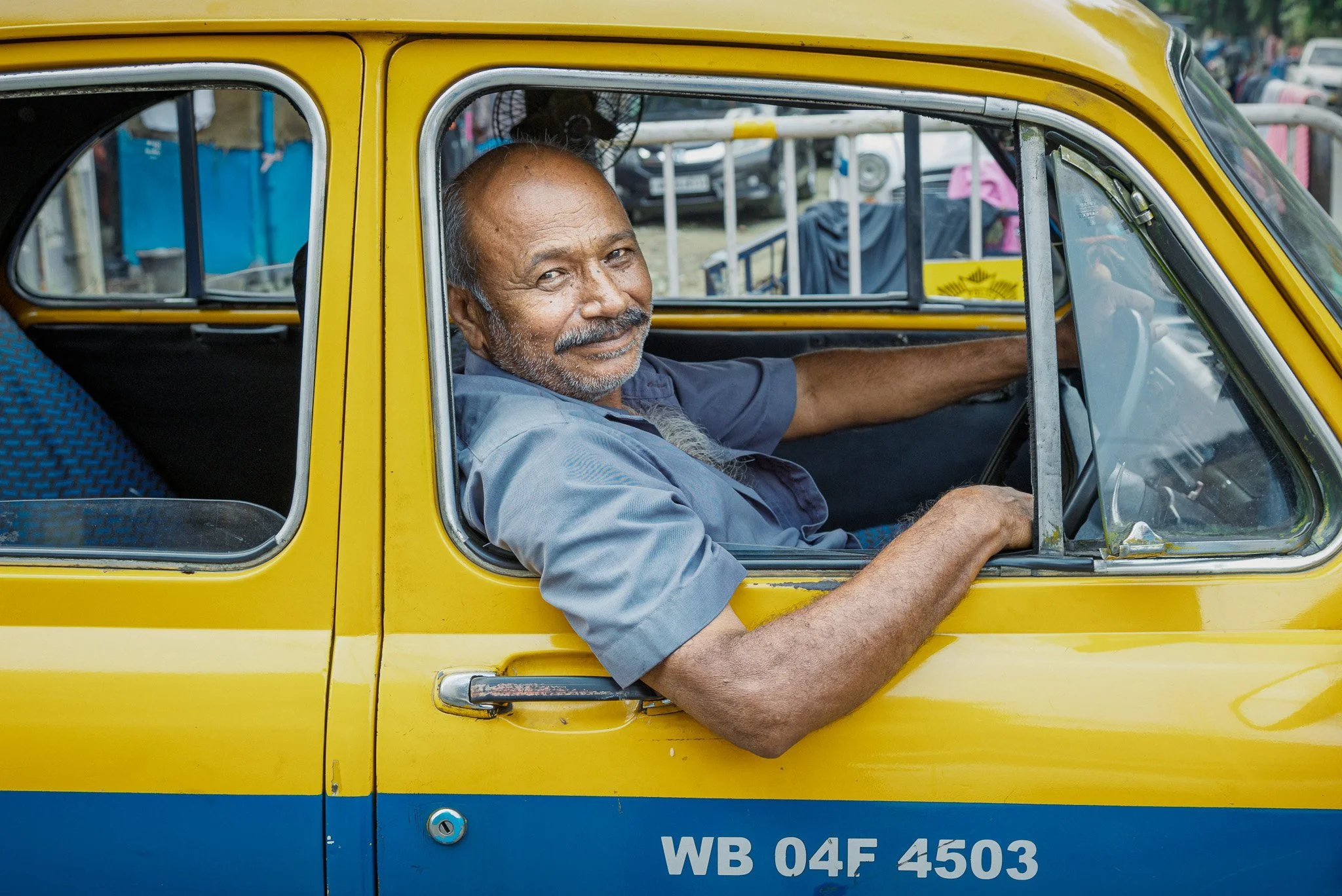 man in a taxi in kolkata