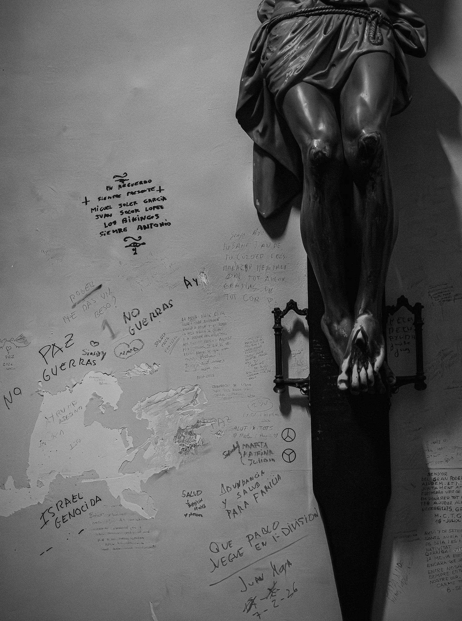 detail of writingon a wall and jesus feet in the chapel of the church of barceloneta