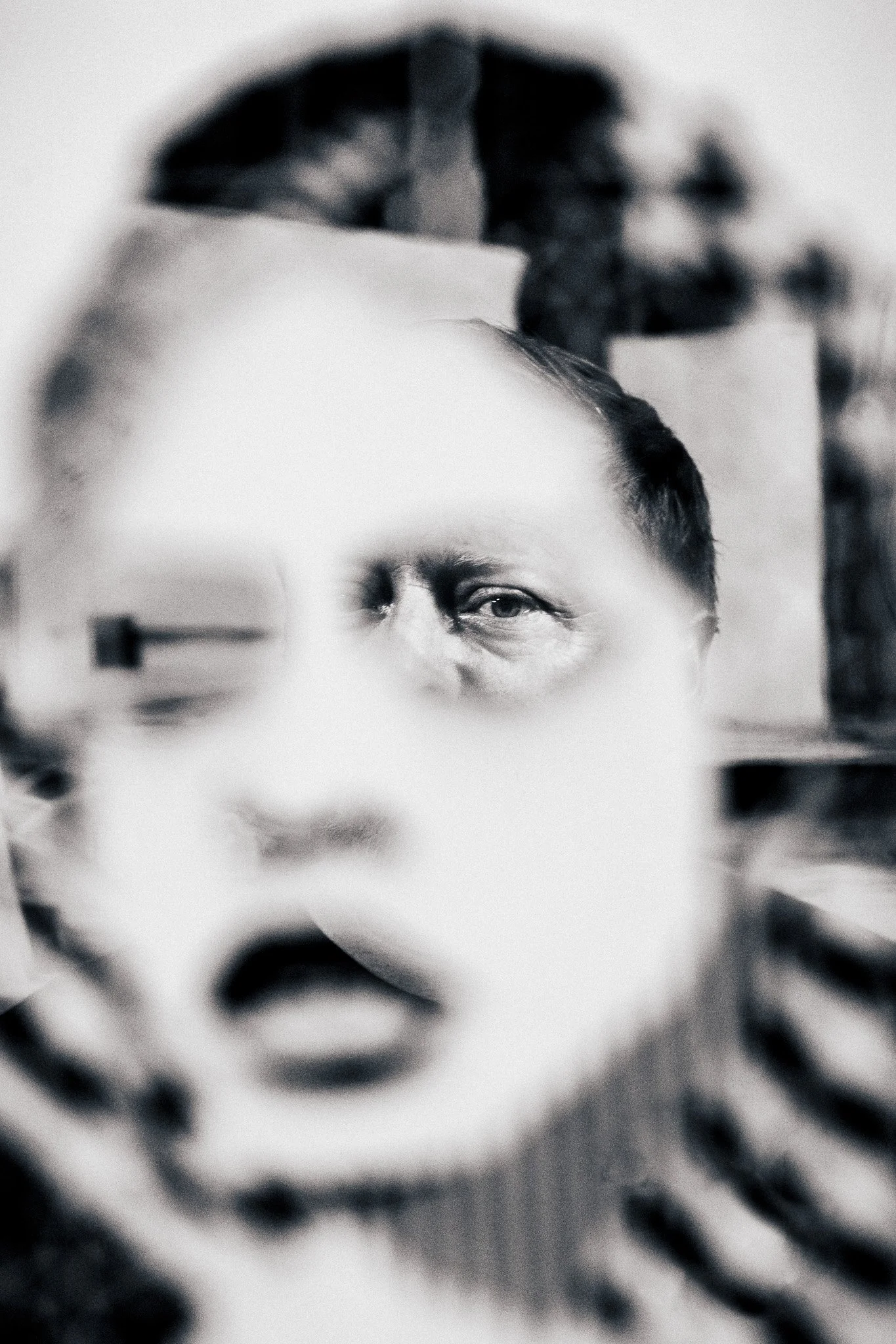 Seen through his own frame.