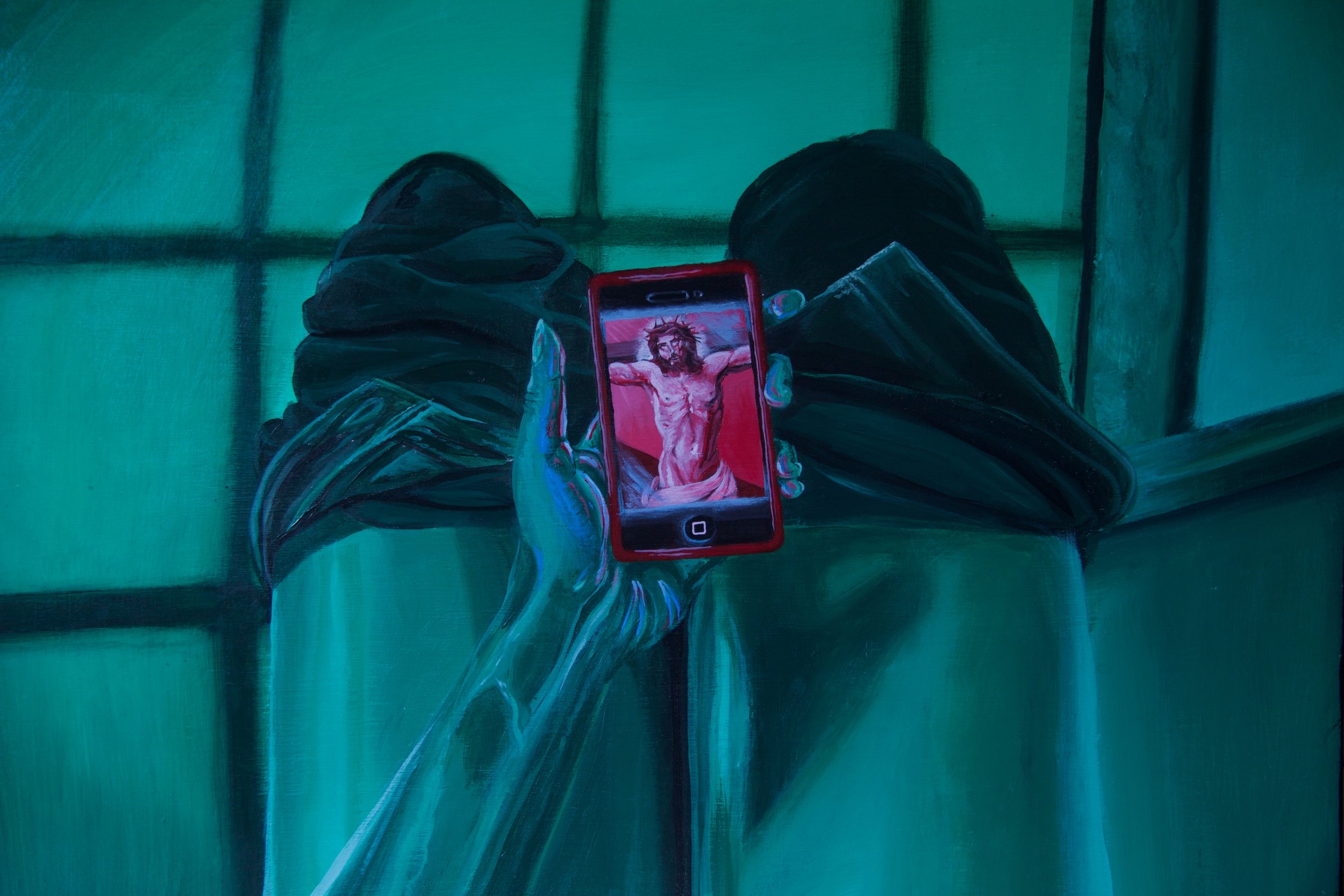 Person sitting on the toilet with the view of their legs, holding a smartphone displaying a drawing of Jesus Christ with a crown of thorns, in front of a green bathroom tile